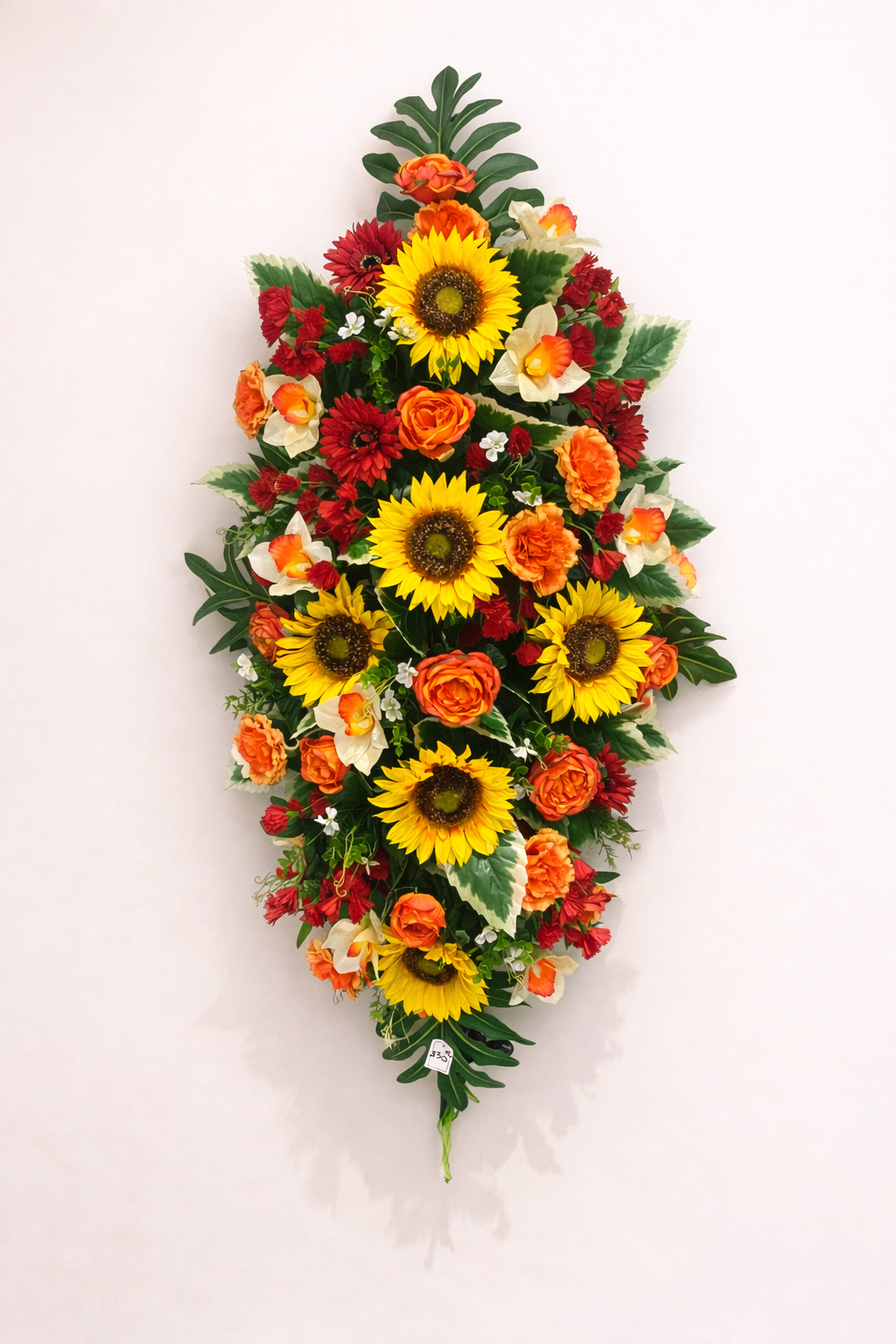 Dessus cercueil tournesols et roses